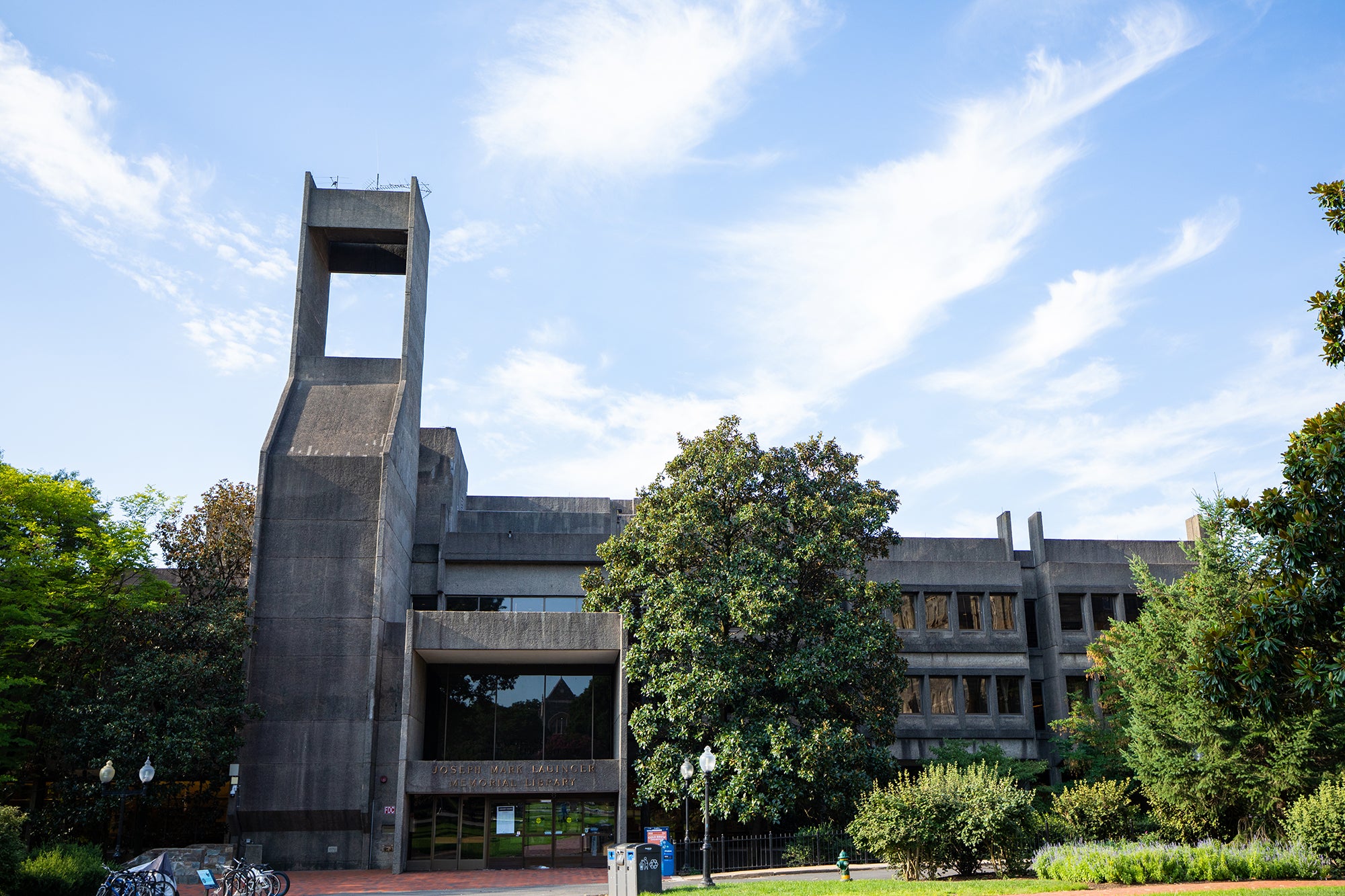 A front-facing view of Lauinger Library, a cement grey brutalist 4-story building.
